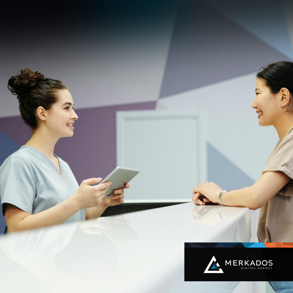 Two women speaking at a chiropractic office 